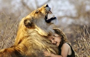 Laughter, a girl laughing with a lion