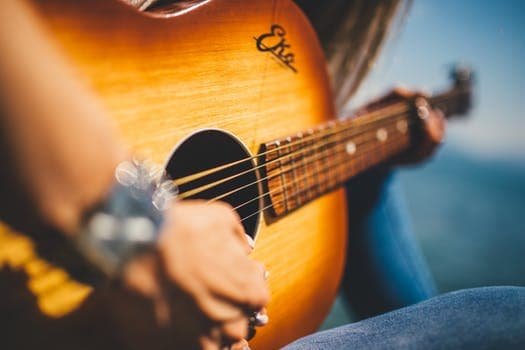 a guitarist with her guitar...