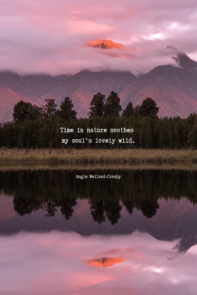 inspirational nature quote | soul quote | wanderlust quote | a picture of nature with mountains, trees, and a reflection in Lake Matheson, New Zeland | "Time in nature soothes my soul's lovely wild."