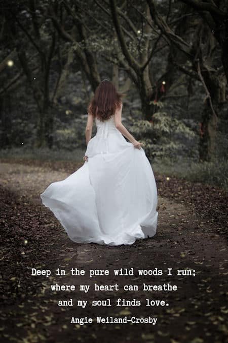 wanderlust quote with a woman running into the woods...
