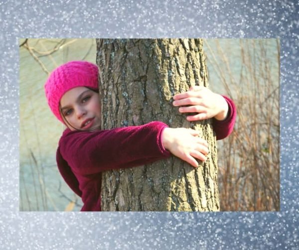 a girl hugging a tree...